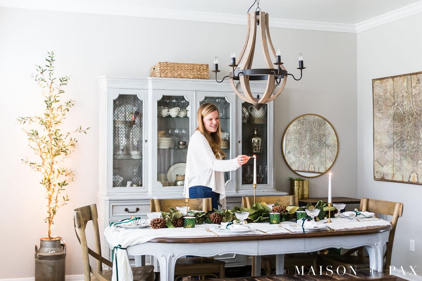 lighting candlestick on christmas table centerpiece | Maison de Pax