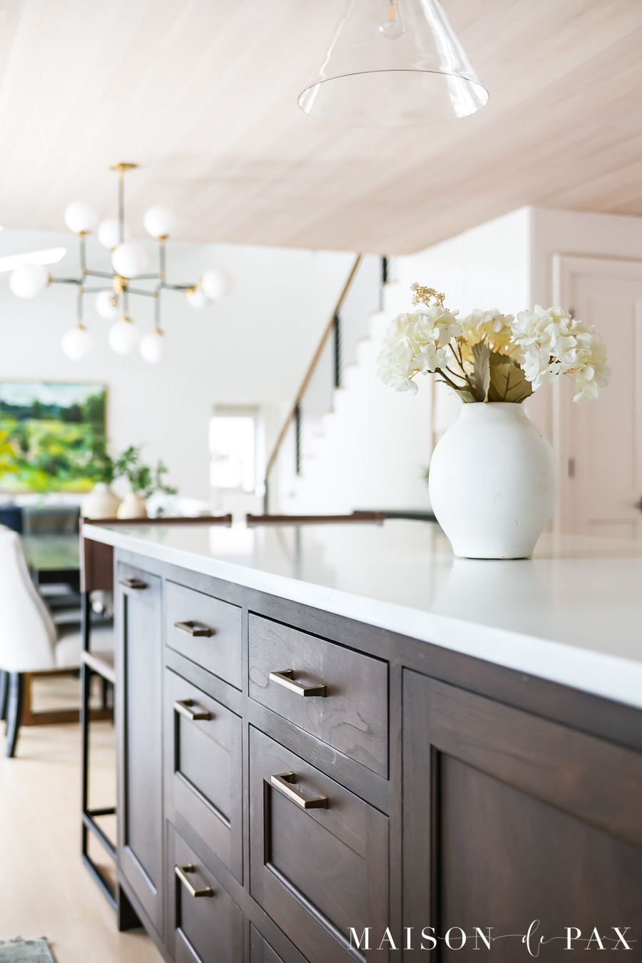 kitchen island looking into dining and living spaces