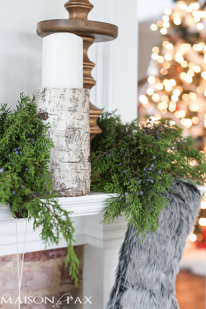 Winter Woodland Christmas Mantel: Looking for mantel decorating ideas? Some fresh cut cedar, candlesticks, and a faux deer mount creates the perfect holiday decor.