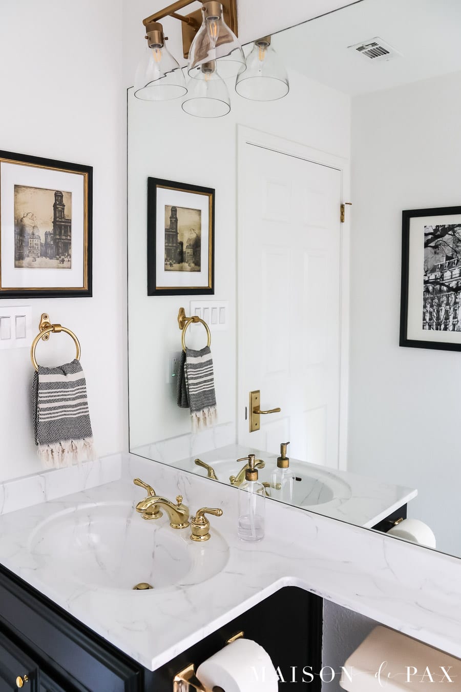 budget bathroom makeover ideas: paint walls, paint countertop to look like marble, paint vanity, hang art