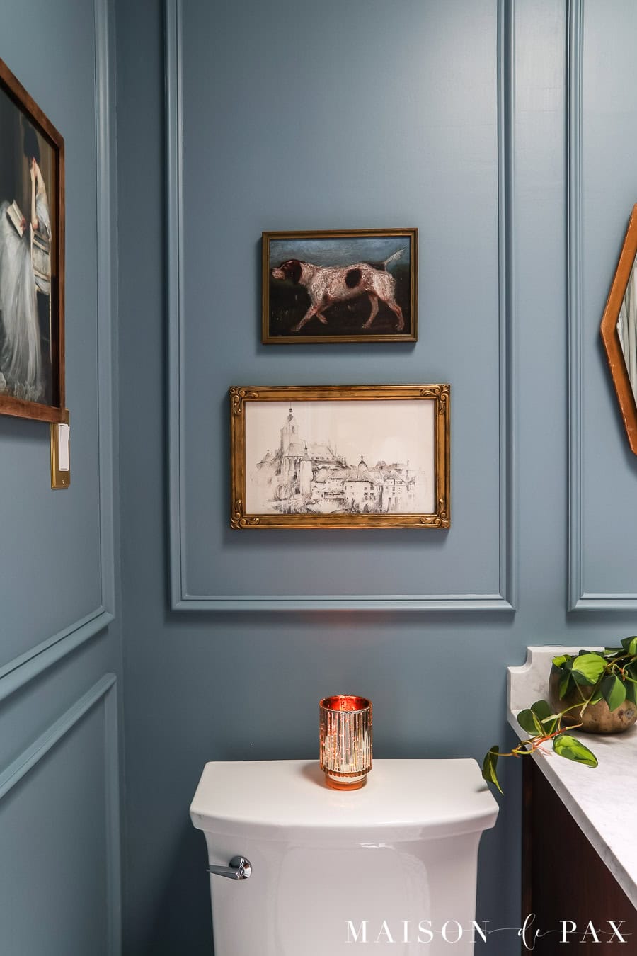 picture frame molding in small bathroom above toilet